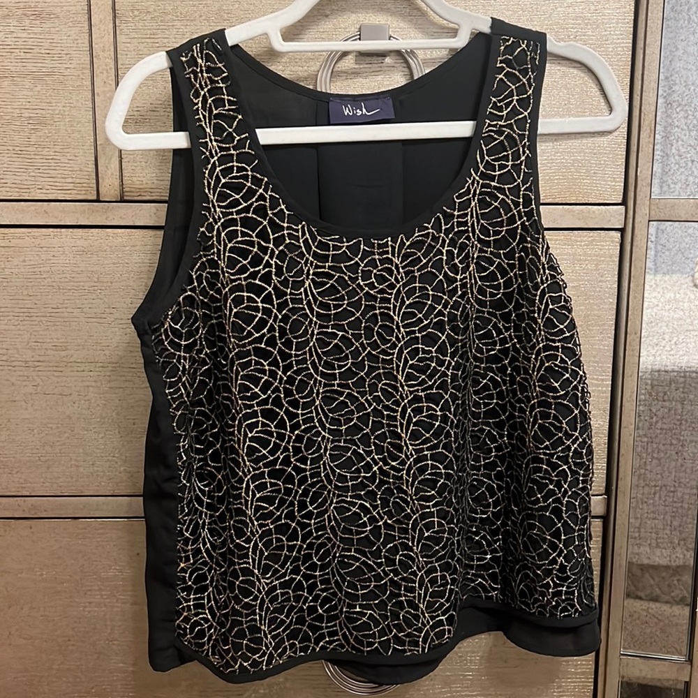 Black sleeveless top with gold embellishment. Size medium. Worn once!
